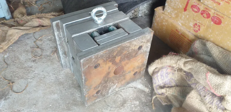 The steel injection mould tool for a moulded component, showing the two halves and lifting eye